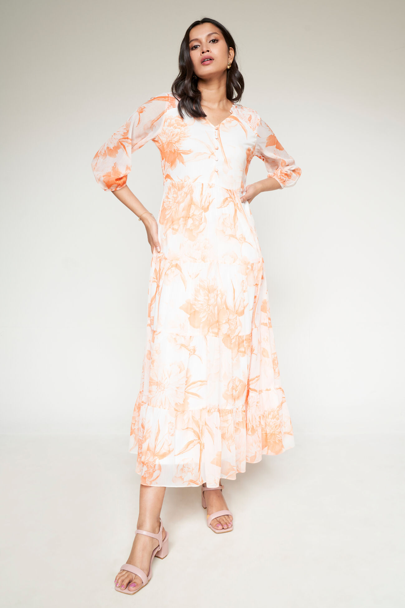 Buy our Orange And Cream Floral Flared Gown online from ANDIndia SC